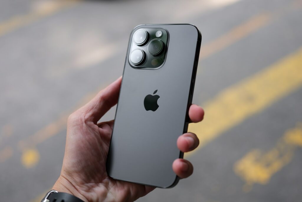 a person holding an iphone in their hand